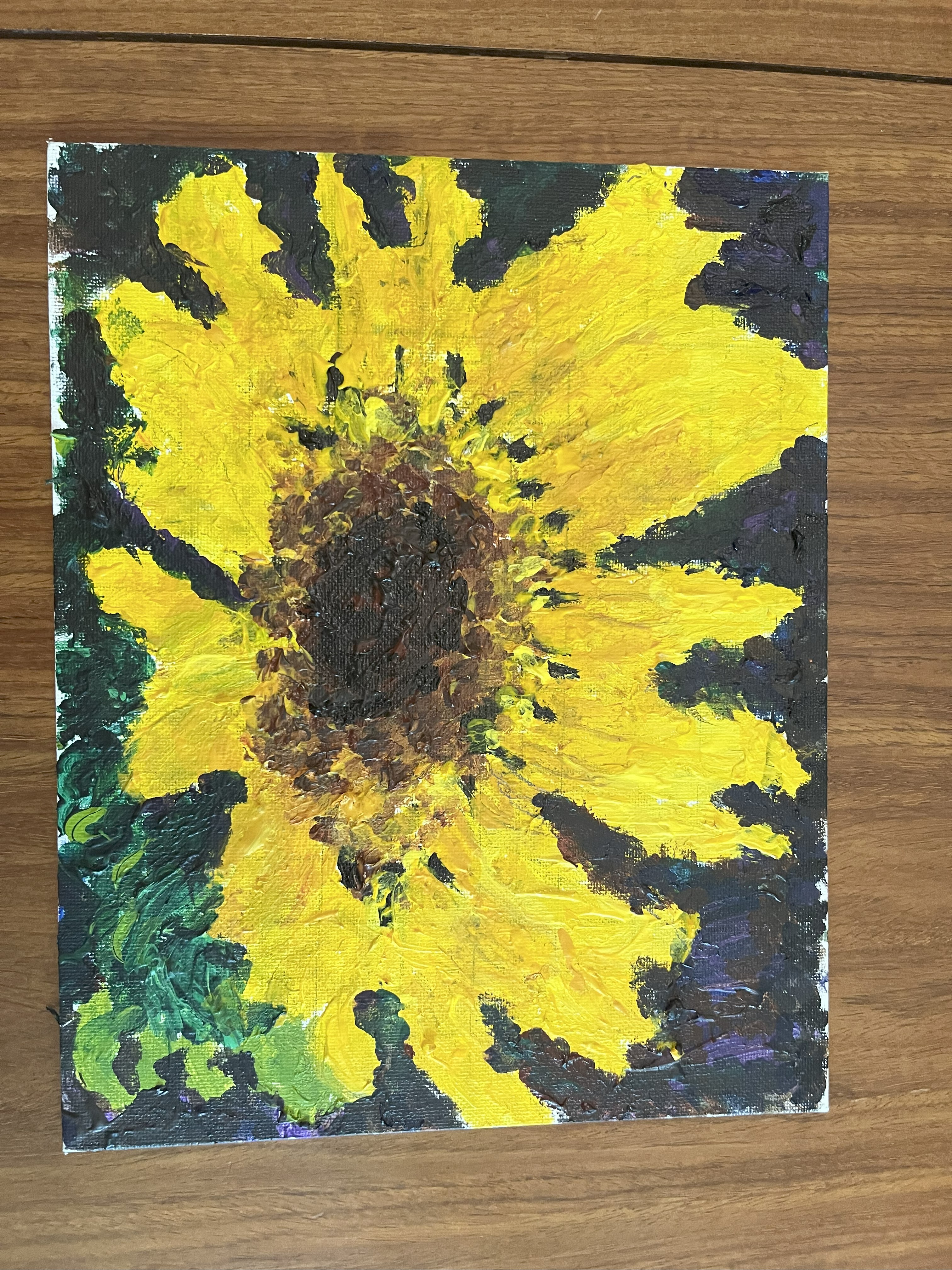 A close-up of a yellow sunflower against a dark background